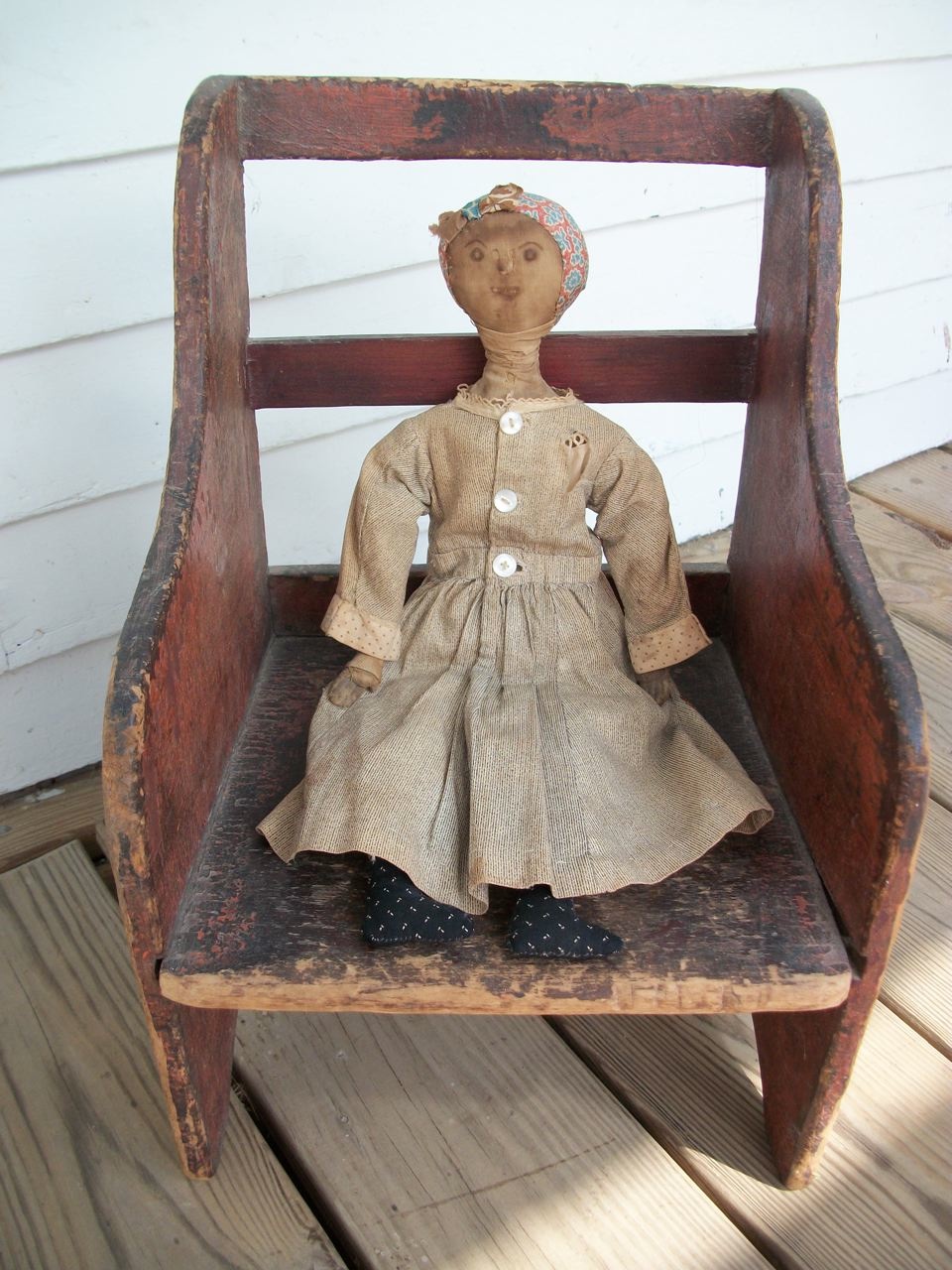 doll on rocking chair